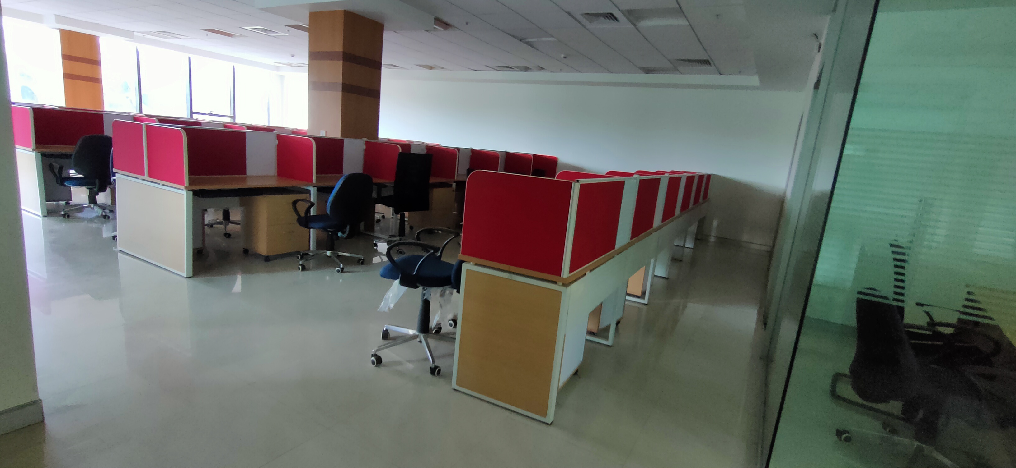 The electronic equipment/computer hardwares/ clocks/access control devices/CCTV/ Phones etc. shown in the image are not a part of our offer.<br>The Plug and Play offices shall be fully furnished offices with state of the art IT office tables and chairs with AC and power connections pre-installed.